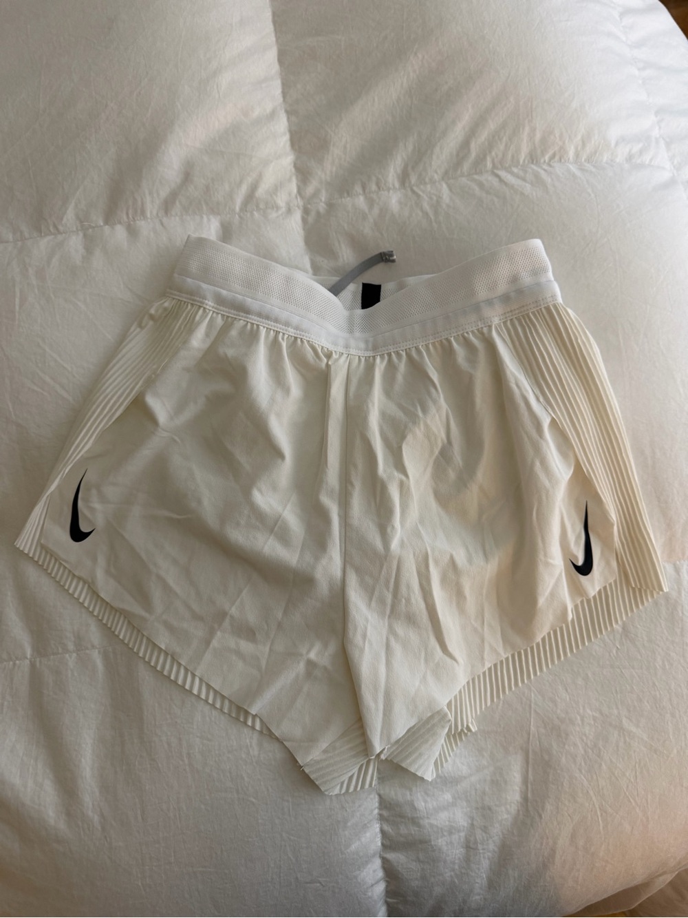 Nike Women's White Athletic Shorts with Black Swoosh